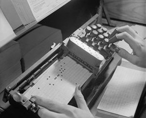 Encoding instructions on a punch card, to be read by a mainframe