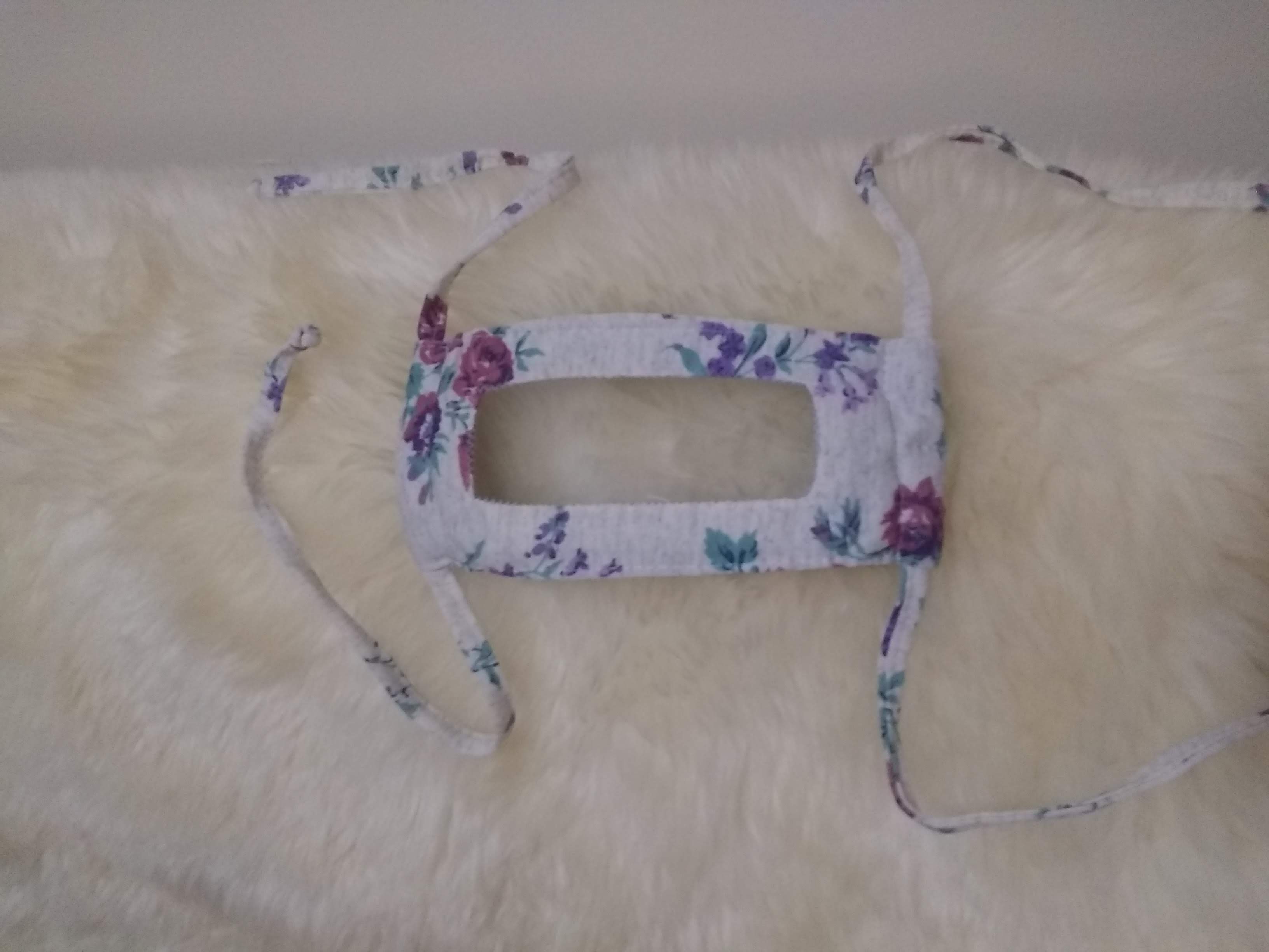 Image of the windowed facemask in white with roses.